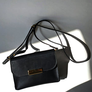 Short Meridian Leather Handbag in Matte Black with adjustable leather strap Directive
